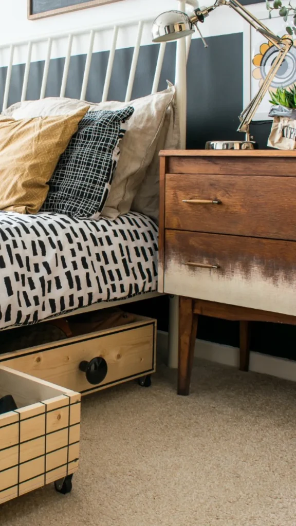 Cozy small bedroom ideas featuring custom rolling wooden crates under a bed frame paired with a mid-century nightstand.